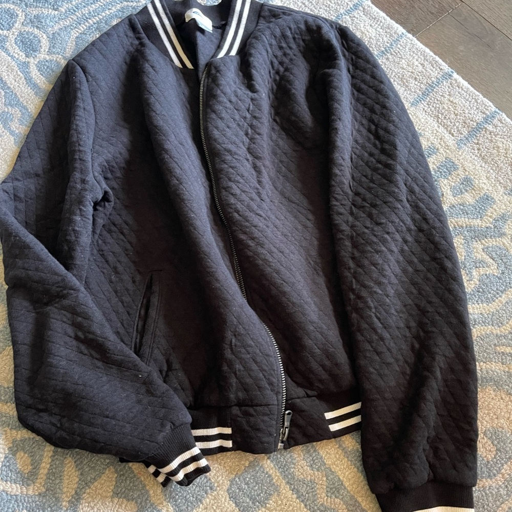 Woman’s old navy sweater. Black with white strip colar and cuff. Size medium.